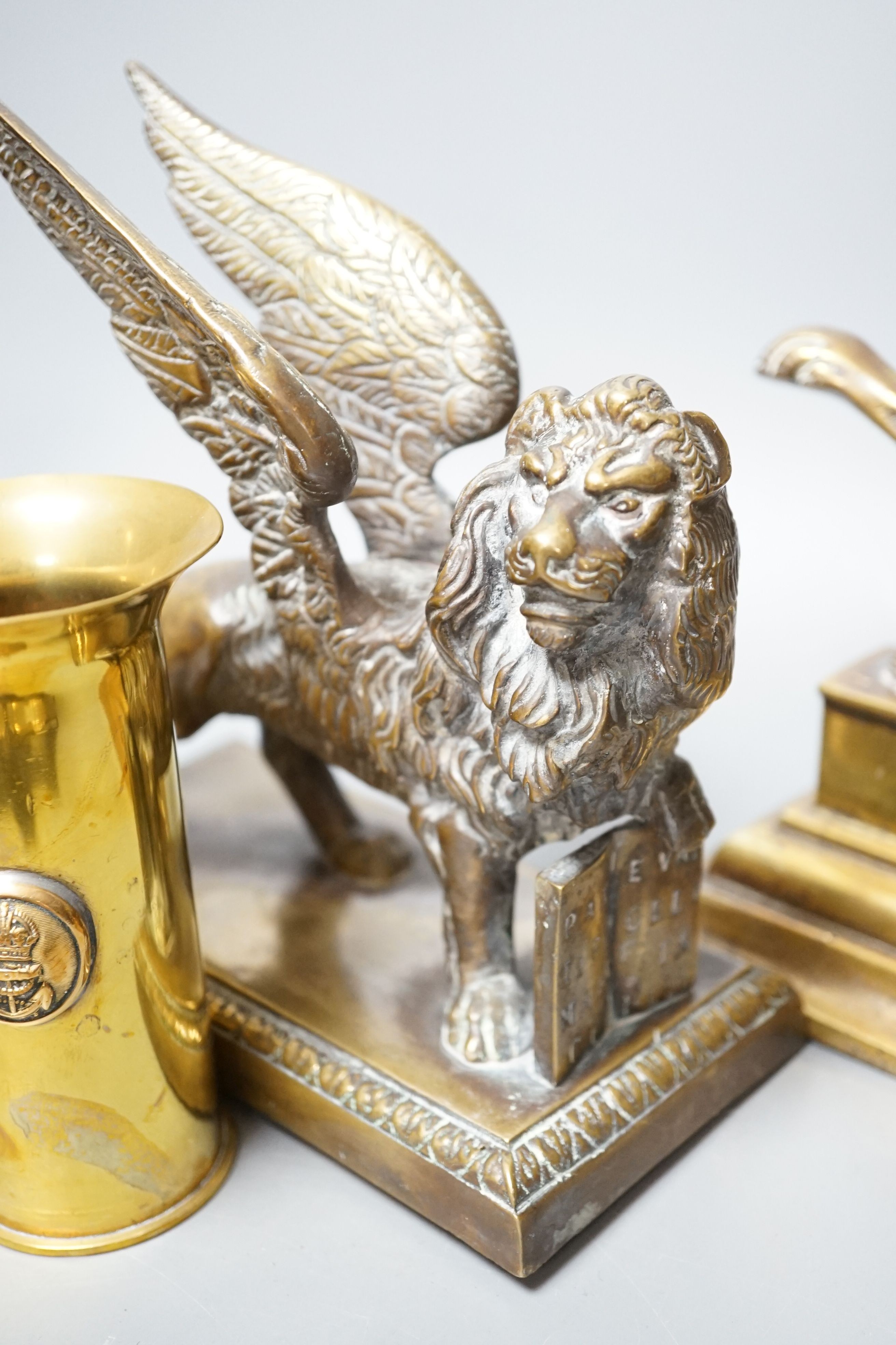 A brass ‘bat’ pin tray, two lion figures and sundry metalware, lion door stop 20 cms height x 25 cms width